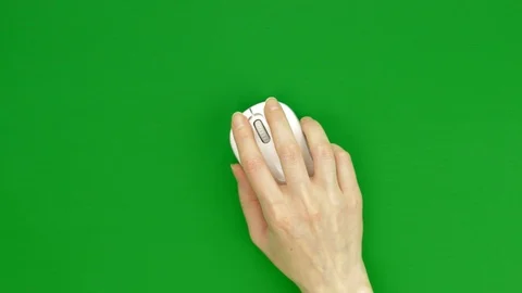 Female hand using white computer mouse on green screen Stock Footage 129008775