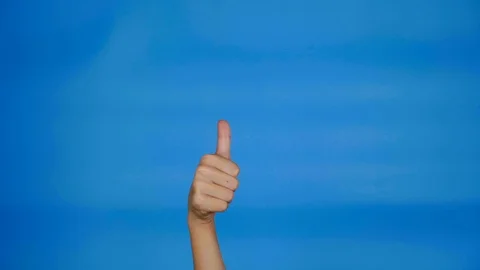 Female hand is waves on a blue background with copy space Stock Footage 121522701
