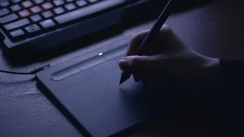 A female hand writes, draws, corrects the image on a graphics tablet at work Stock Footage 142747298