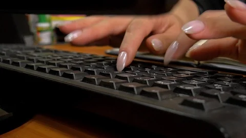 Female hands actively typing on PC keyboard at the office close up Stockbeeldmateriaal 123332769