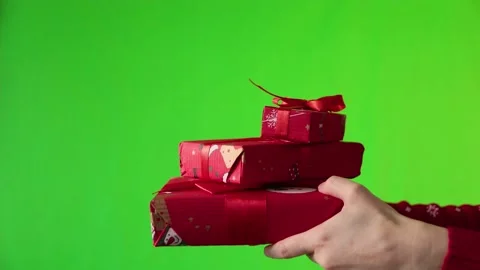 Female hands and gift boxes on the green background. Stock Footage 165554477