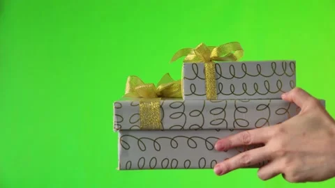 Female hands and gift boxes on the green background. Stock Footage 166120181