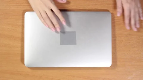 Female hands are open gray laptop typing on a laptop. Top view Stock Footage 132878889