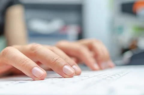 Female hands are typing on a computer or laptop keyboard. Stock Photos