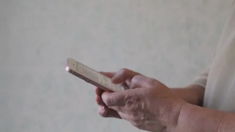 Female hands are typing a message on the smartphone. Stock Footage 143654405