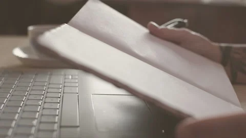Female hands are writing in a notebook. Close-up. HD Stockbeeldmateriaal 101432816