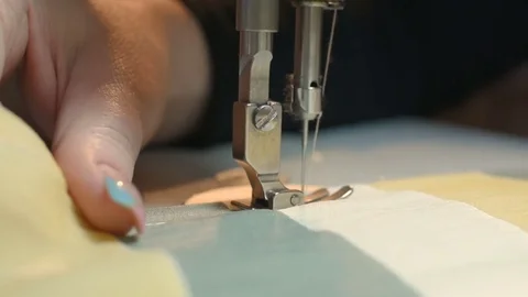 Female hands on the background of a sewing machine 動画素材 74276699