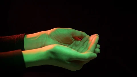 Female hands on a black background Stock Footage 127377830