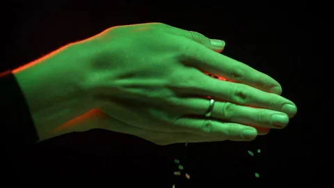 Female hands on a black background Stock Footage 127793612