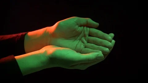 Female hands on a black background Stock Footage 127794337