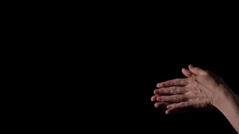 Female hands on a black background Stock Footage 140683646