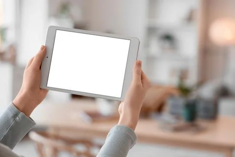 Female hands with blank tablet computer at home, closeup Stock Photos