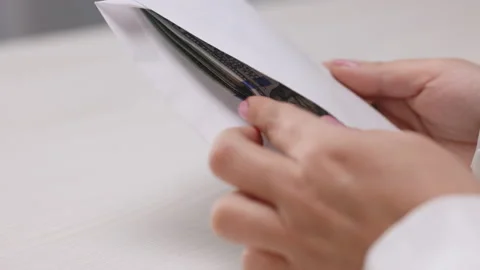 Female hands checking dollar bills in envelope, witness bribing, illegal salary Stock Footage 194669748