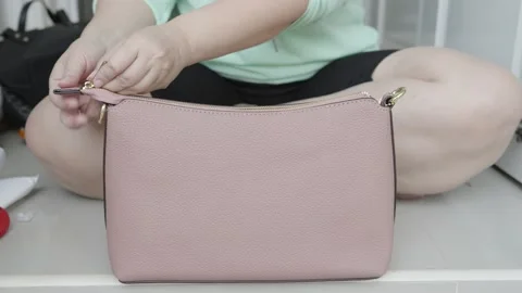 Female hands checking new hand bag from online shopping. Stock Footage 232588502