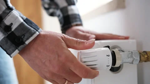 Female Hands Checking Temperature And Adjusting Heater 库存影片 315679354