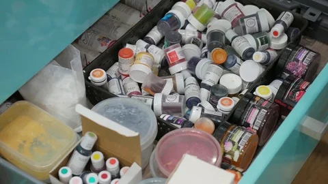 Female hands choosing the bubbles with paint. Close-up Stock Footage 82139895
