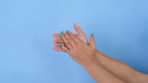 Female hands clapping and congratulations gestures on blue background. Stock Footage 235577255