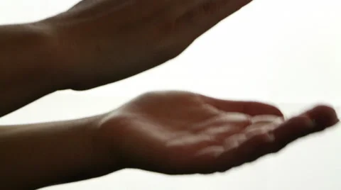 Female hands clapping on a black background, close up Stock Footage