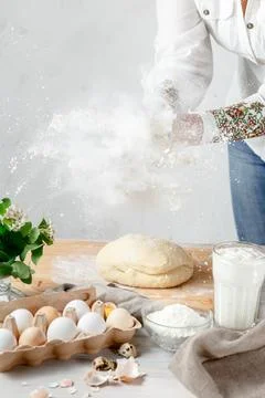 Female Hands Clapping Making Flour Splash above the Dough Stock Photos