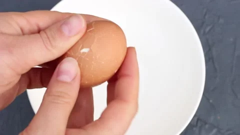 Female hands clean eggshell top view. Stock Footage 122305737
