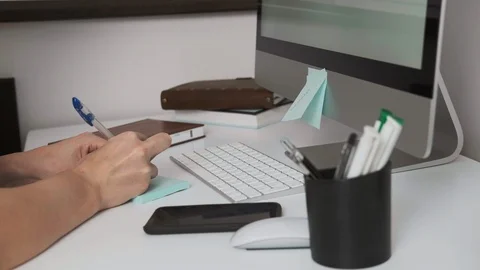 Female hands, close-up. Makes notes on stickers. Writes to stick. Stock Footage 107340293