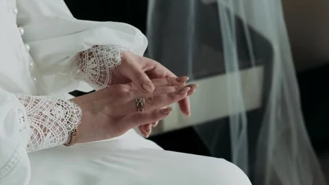 Female hands close-up touching a ring	 Stock Footage 255274235