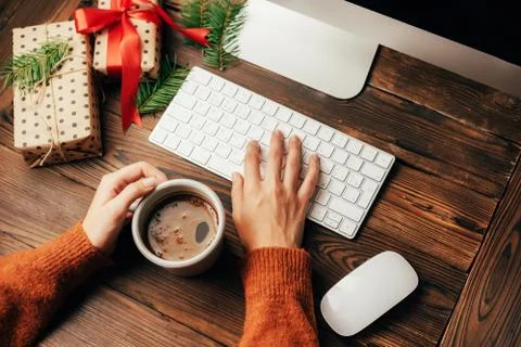 Female hands on a computer keyboard. Stock Photos