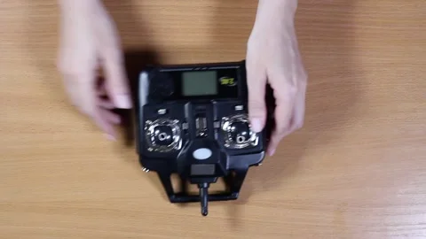 Female hands control the controller for the drone Stock Footage 132879024