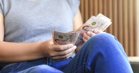 Female hands counting banknotes, personal finance, budgeting, savings, cash.. Stock Footage 340614712