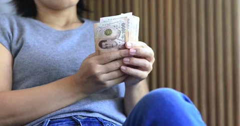 Female hands counting banknotes, personal finance, budgeting, savings, cash.. Stock Footage 345870445