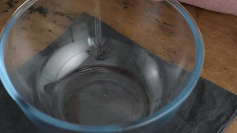Female hands crack egg. Breaking an egg. Greek cheese pie. A woman prepares a Stock Footage 141358486