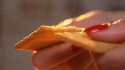 Female hands cracking crisp bread in slow motion closeup Stock Footage 120876743