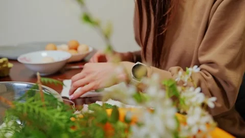Female Hands Creating Botanical Easter Egg Design With Fresh Spring Elements Stock Footage 334619706