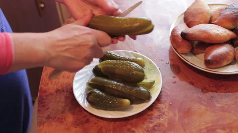 Female hands cut cucumber Stock Footage 64981214