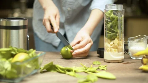 Female hands cutting lime Stock Footage 127556290