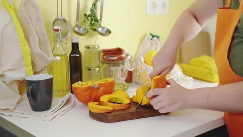Female hands cutting pumpkin with a knife. Stock Footage 159141013