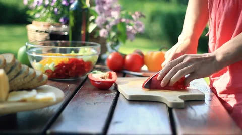 Female hands cutting red pepper, outdoors, dolly shot HD Stock-Footage 5704276
