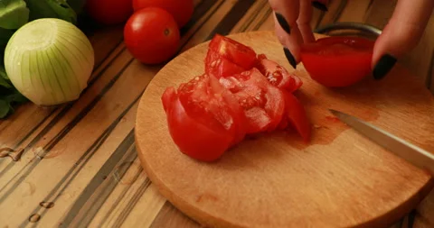 Female hands cutting tomatoes Stock Footage 244075134