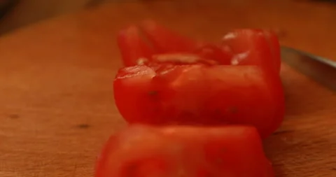 Female hands cutting tomatoes Video stock 244075828