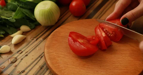 Female hands cutting tomatoes Stock Footage 244075844