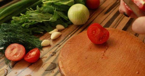 Female hands cutting tomatoes Stock Footage 244076090