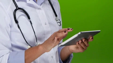 Female hands doctors work on the tablet pc. Close up Stock Footage 70223101
