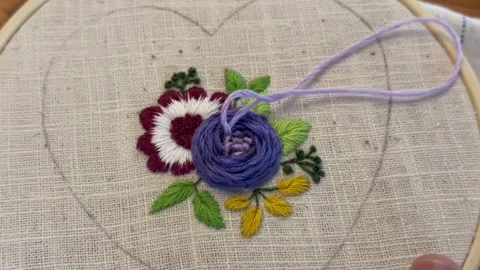 Female hands doing hand embroidery stitching process, textile detail Stock Footage 335193790