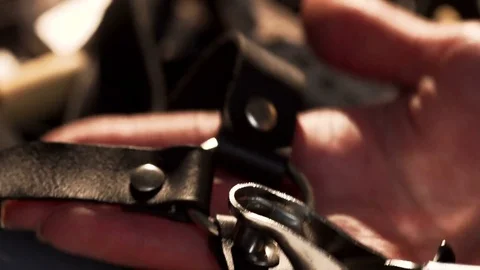 Female hands during handmade workshop with leather, using special instruments Stock Footage 77414120