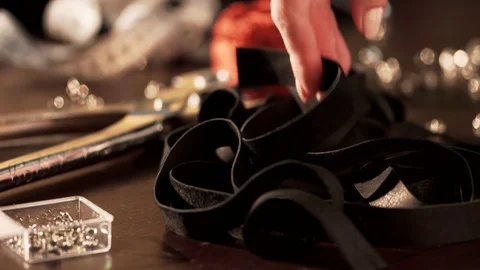 Female hands during handmade workshop with leather, using special instruments Stock Footage 77414234