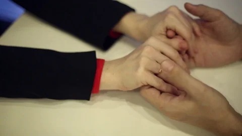 Female hands embracing a man's hands Stock Footage 70280562