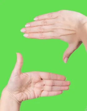 Female hands forming rectangle shape as if focusing at main point Stock Photos