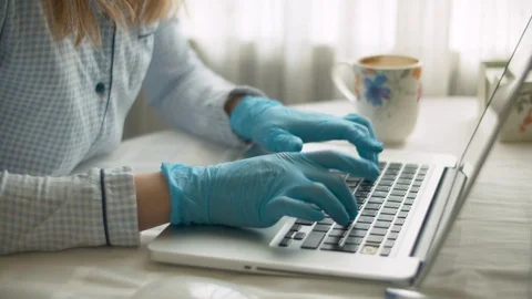 Female hands in gloves typing on a computer Stock Footage 126817854