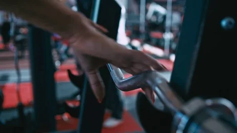 Female hands grabbing barbell. Loop Stock Footage 82519928