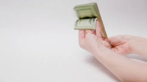 Female hands hold stack of paper dollar bills and show money. Stock Footage 220324305